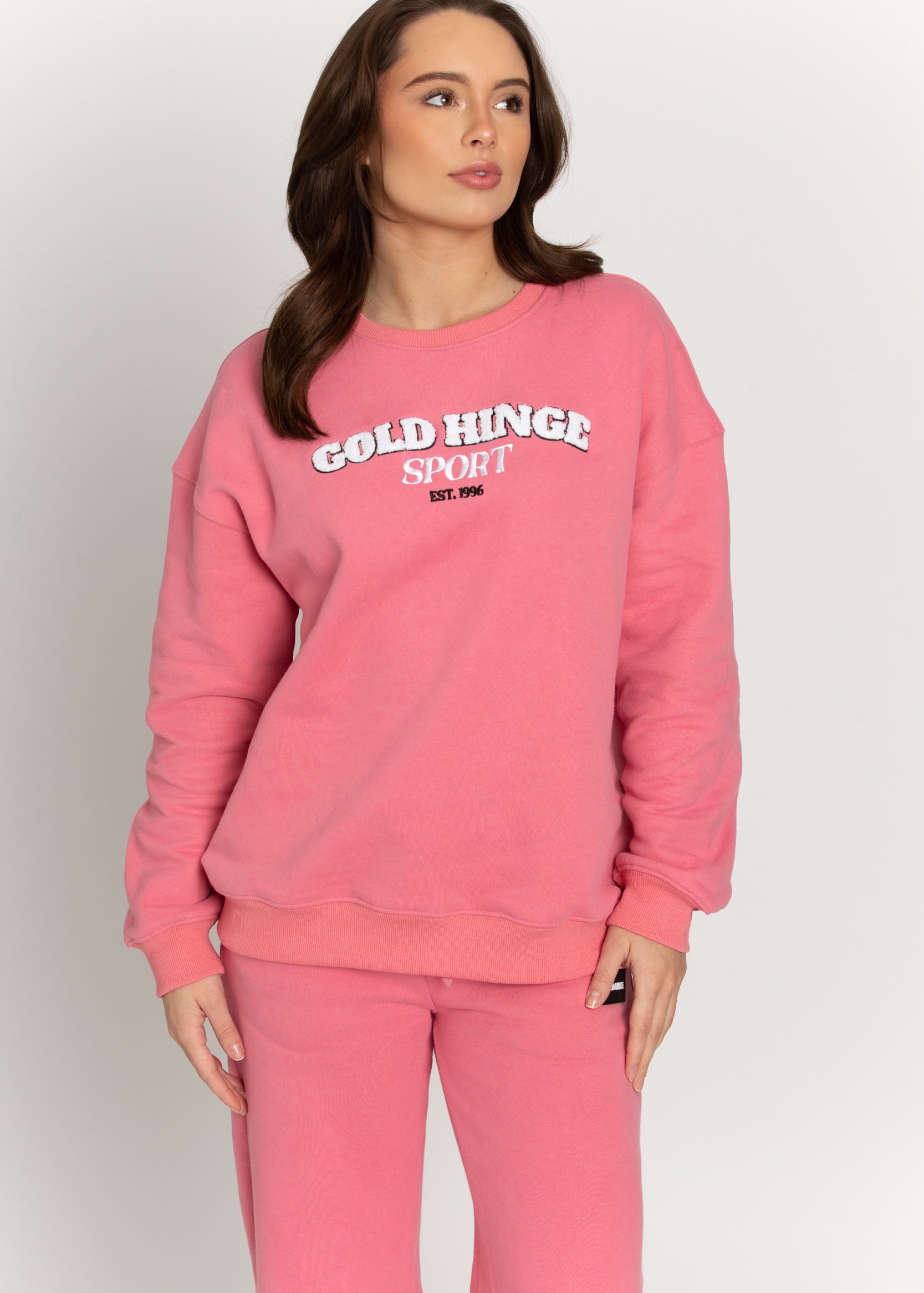 Upgrade your wardrobe with this Rouge GH Sport Sweatshirt. Featuring a fuzzy 3D lettering design, this classic piece can be layered with a bold jacket and beanie for colder weather, or be paired with a tennis skirt for a more casual look.