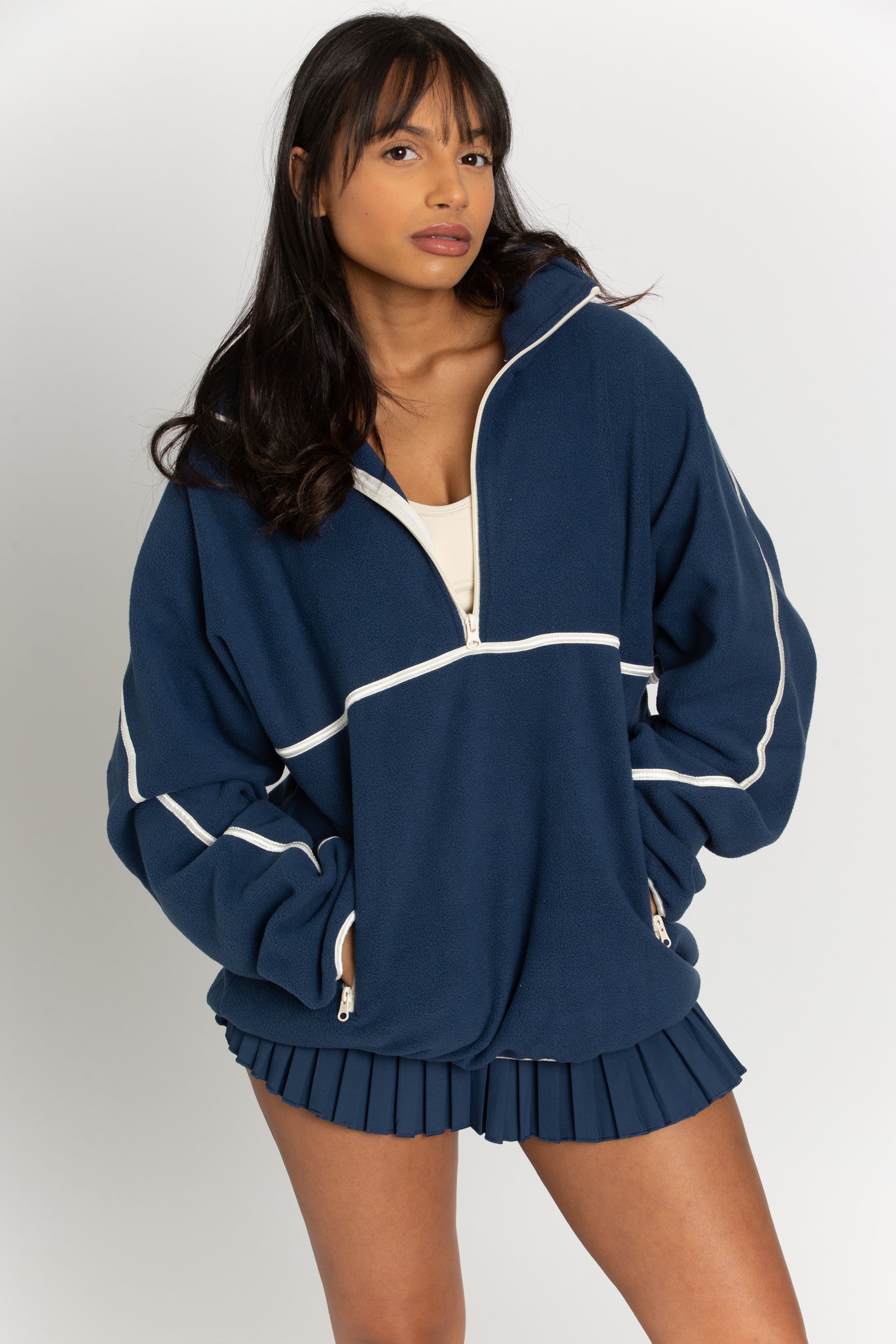 This navy minimalistic half-zip pullover is the perfect way to stay warm and comfortable while looking stylish. The lightweight material is perfect for layering over any outfit and the half-zip design gives it a modern twist.