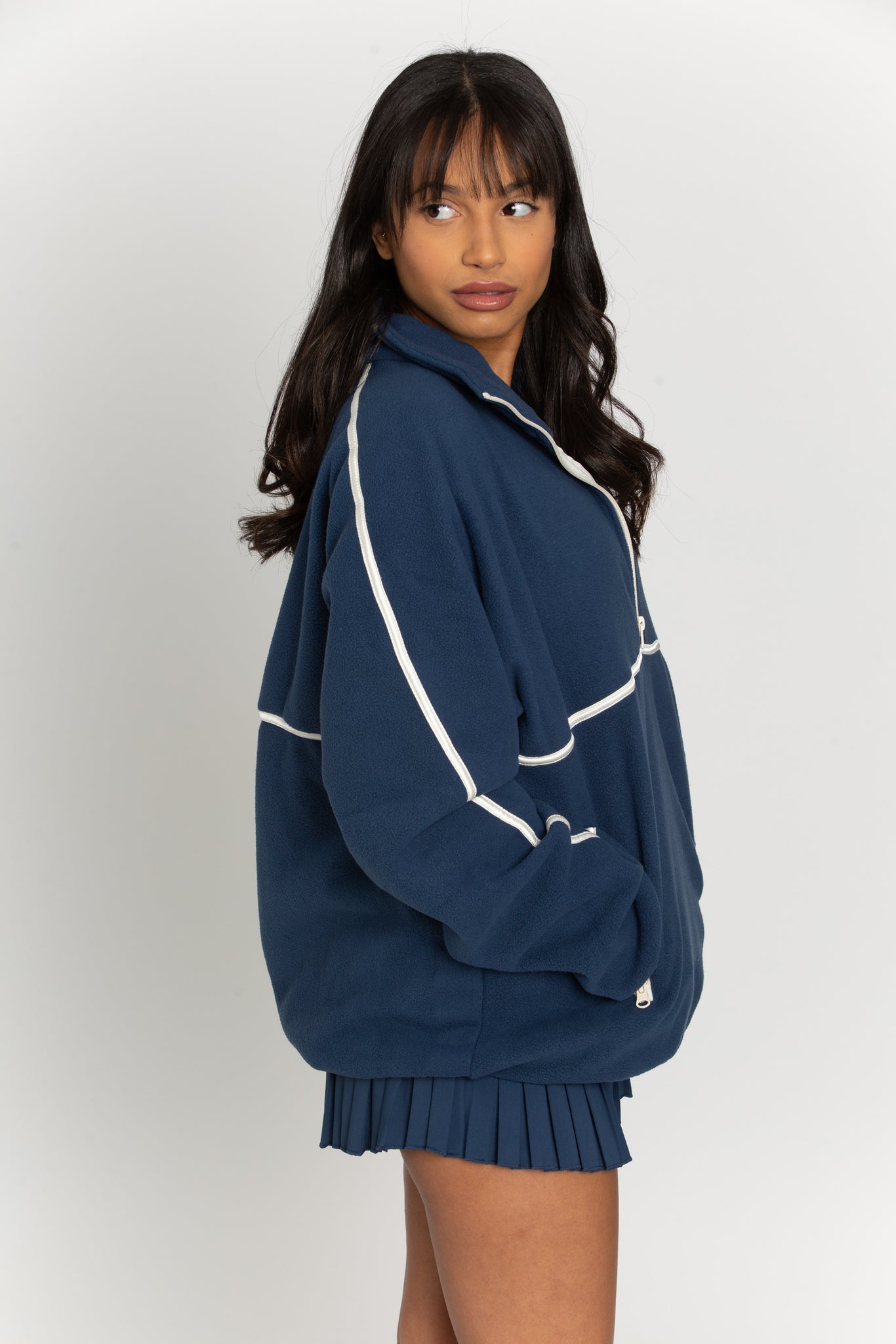 This navy minimalistic half-zip pullover is the perfect way to stay warm and comfortable while looking stylish. The lightweight material is perfect for layering over any outfit and the half-zip design gives it a modern twist.